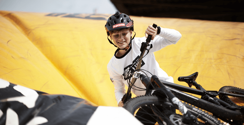 A youth rider lands on the Dirt Factory airbag