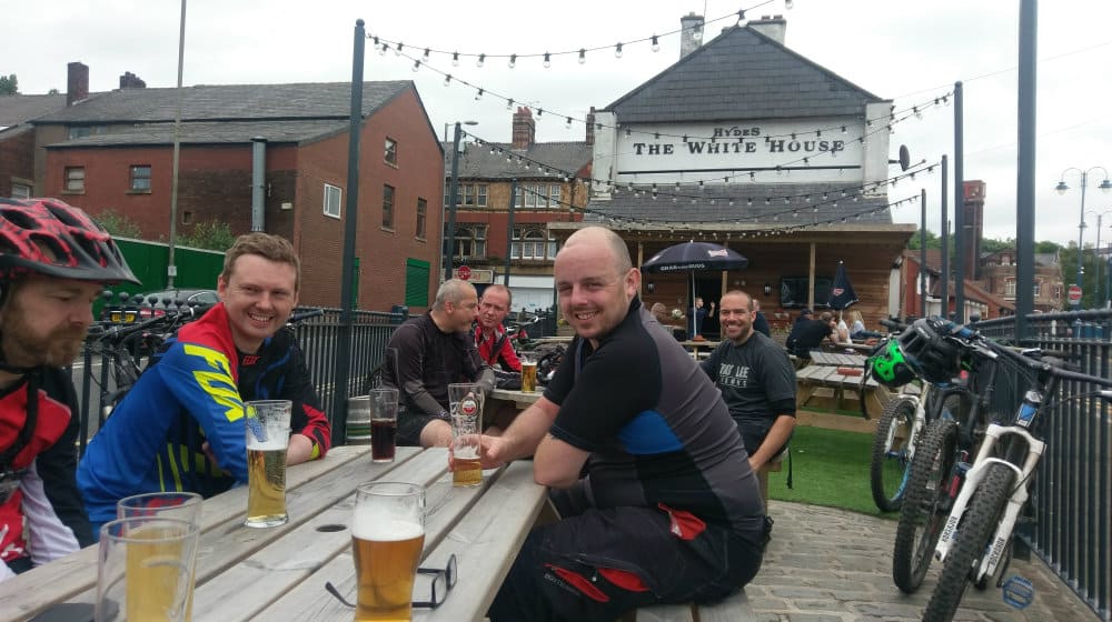 Mountain bikers having a pint after a ride.